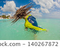 Teen boy swimming alone in turquoise Caribbean sea, enjoying tropical water, sunny beach vacation, active childhood and summer travel concept 140267872