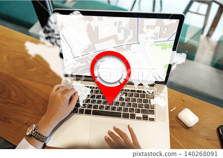 Person checks taxi location on map using laptop in urban setting around midday Person checks taxi location on map using laptop in urban setting around midday 140268091