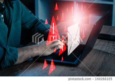 Person typing on laptop while scam messages and warning symbols appear on screen Person typing on laptop while scam messages and warning symbols appear on screen 140268105