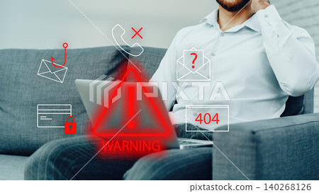 Scam call and SMS alert received by a person sitting on a couch with a laptop in a room Scam call and SMS alert received by a person sitting on a couch with a laptop in a room 140268126