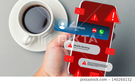 Scam call and message alert shown on a smartphone with a cup of coffee nearby Scam call and message alert shown on a smartphone with a cup of coffee nearby 140268132