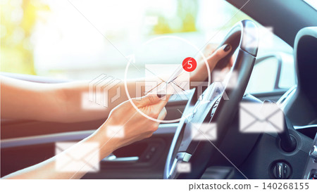 Person uses phone while driving with notifications indicating new messages Person uses phone while driving with notifications indicating new messages 140268155