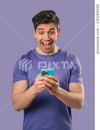 Surprised Man Looking at Smartphone Screen After Receiving News, social media Surprised Man Looking at Smartphone Screen After Receiving News, social media 140268260