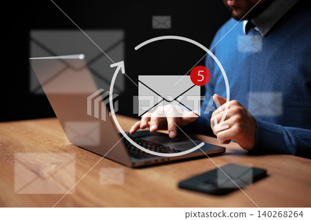 Person checks email on laptop while notifications appear on screen Person checks email on laptop while notifications appear on screen 140268264