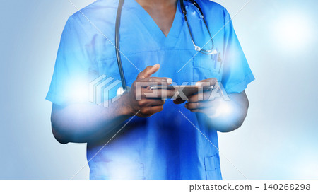 Healthcare worker uses smartphone in medical setting during daytime Healthcare worker uses smartphone in medical setting during daytime 140268298