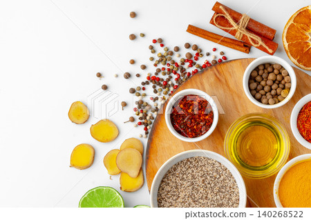 Details about various spices and ingredients on a wooden board in the kitchen space Details about various spices and ingredients on a wooden board in the kitchen space 140268522