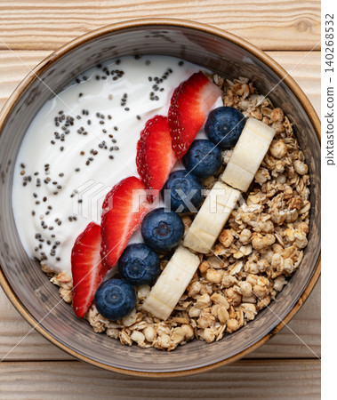 Healthy breakfast bowl granola yogurt berries Healthy breakfast bowl granola yogurt berries 140268532