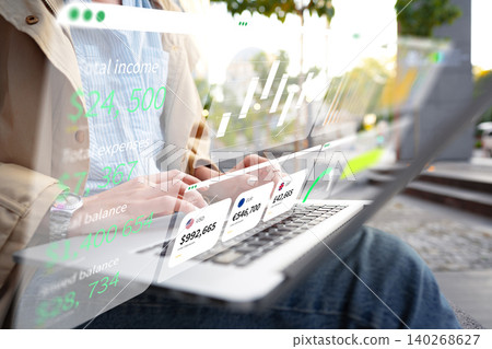 Person using laptop to analyze digital business chart with AI features in outdoor setting Person using laptop to analyze digital business chart with AI features in outdoor setting 140268627