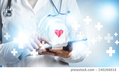 Doctor uses tablet to manage patient health data in hospital setting with medical symbols Doctor uses tablet to manage patient health data in hospital setting with medical symbols 140268818