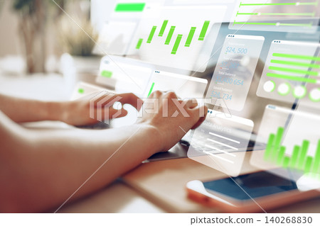 Exploring digital business charts with AI tools at a workspace setting Exploring digital business charts with AI tools at a workspace setting 140268830