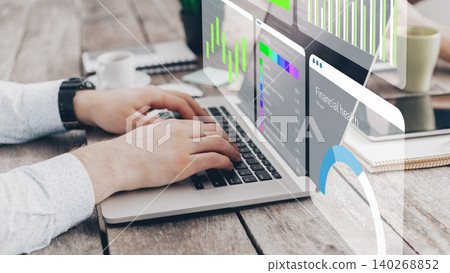 Digital business analysis using AI tools on a laptop at a workspace desk Digital business analysis using AI tools on a laptop at a workspace desk 140268852