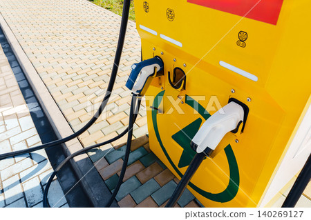 Electric car charger located in a public area ready for use Electric car charger located in a public area ready for use 140269127