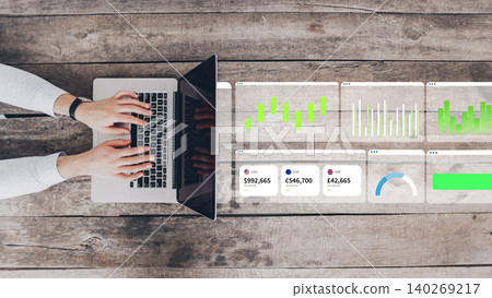 Creating digital business charts with AI on a laptop at a wooden desk Creating digital business charts with AI on a laptop at a wooden desk 140269217