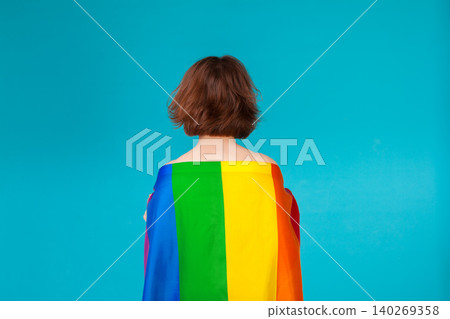 young woman covering with lgbt pride flag young woman covering with lgbt pride flag 140269358