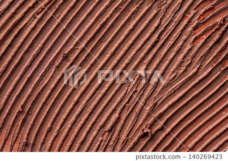 Textured smears of dark skin foundation, background 140269423