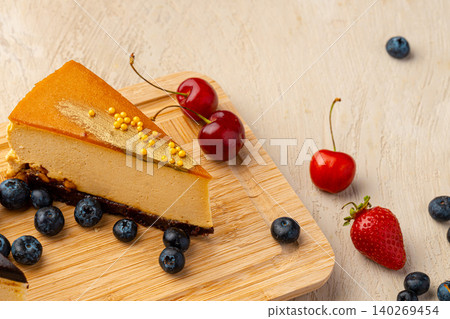 Piece of caramel souffle cake with berries Piece of caramel souffle cake with berries 140269454