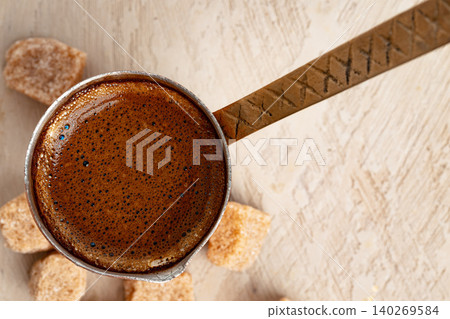 Turkish coffee with foam in copper turk Turkish coffee with foam in copper turk 140269584