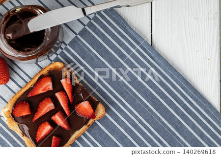 Sandwich toast with chocolate paste and cut strawberry Sandwich toast with chocolate paste and cut strawberry 140269618