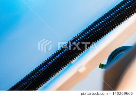 Close up of a plastic corrugated hosepipe in industrial factory Close up of a plastic corrugated hosepipe in industrial factory 140269666
