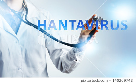 Stethoscope held by a doctor with the word hantavirus displayed clearly in the background Stethoscope held by a doctor with the word hantavirus displayed clearly in the background 140269748