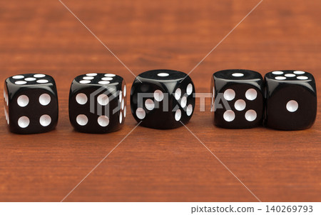 Dice on a wooden table. Concept for business risk. Dice on a wooden table. Concept for business risk. 140269793