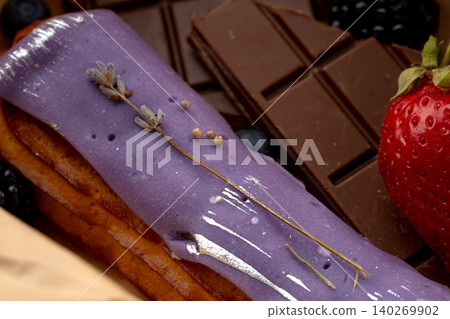 Eclair cake with lavender glaze close up 140269902