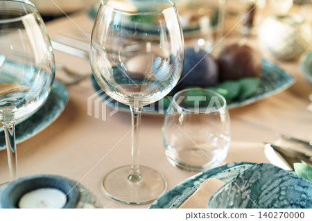 Beautiful elegant table setting with green stylish dishware and silver cutlery Beautiful elegant table setting with green stylish dishware and silver cutlery 140270000