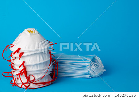 Many stacked medical protective face masks close up Many stacked medical protective face masks close up 140270159