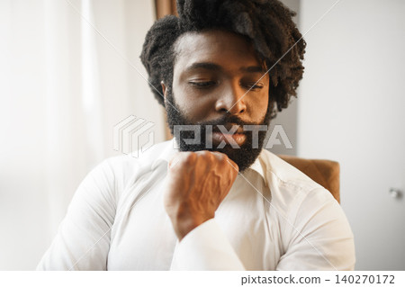 Close up shot of serious dark-skinned man Close up shot of serious dark-skinned man 140270172
