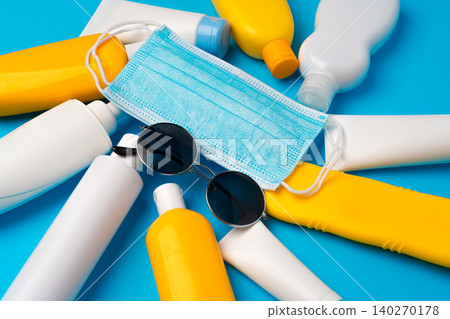 Sunscreen cream and protective mask. Coronavirus summer concept 140270178