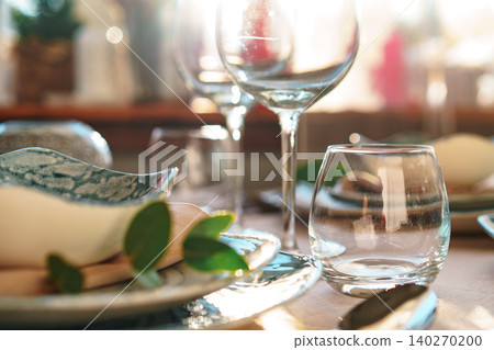Beautiful elegant table setting with green stylish dishware and silver cutlery Beautiful elegant table setting with green stylish dishware and silver cutlery 140270200