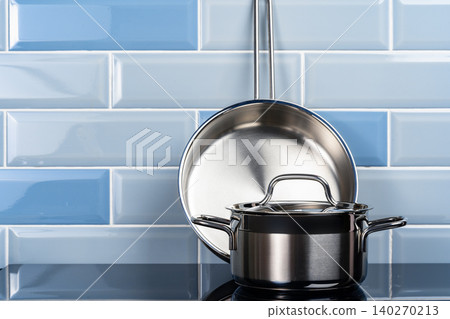 Set of aluminum cookware on kitchen counter Set of aluminum cookware on kitchen counter 140270213