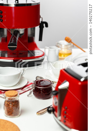Close up of red kitchen .appliances on kitchen table 140270217