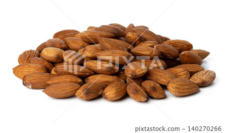 Heap of roasted almonds isolated on white Heap of roasted almonds isolated on white 140270266