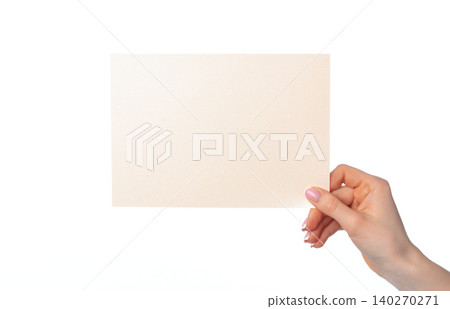 Woman's hand holding blank white sheet of paper isolated on white 140270271