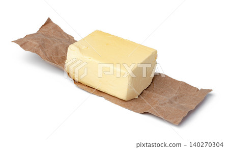 Fresh butter on craft paper isolated on white background 140270304