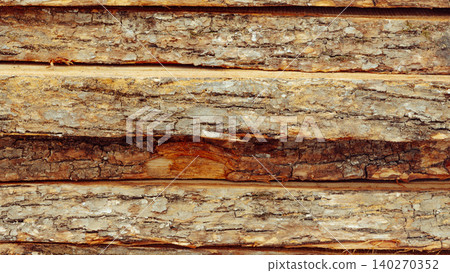 Wood logs stacked in a storage area ready for processing and use throughout the day Wood logs stacked in a storage area ready for processing and use throughout the day 140270352