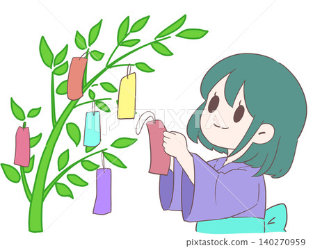 一個女孩正在用紙條裝飾竹枝。 140270959