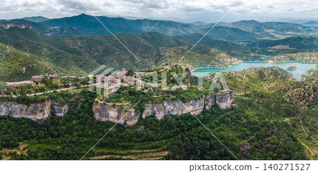 Aerial panoramic view of Siurana village perched on dramatic cliffs above Siurana Reservoir in Catalonia, Spain Aerial panoramic view of Siurana village perched on dramatic cliffs above Siurana Reservoir in Catalonia, Spain 140271527