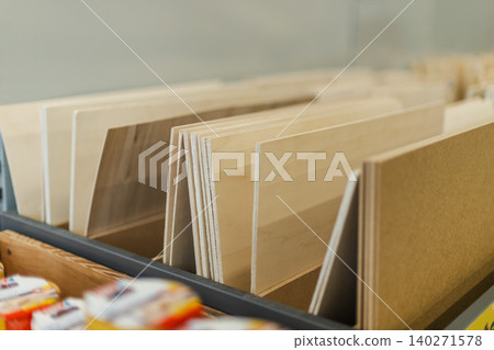 Plywood and wooden boards displayed in hardware and home improvement store Plywood and wooden boards displayed in hardware and home improvement store 140271578