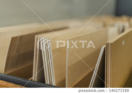 Stacked plywood sheets and wooden panels in hardware store display Stacked plywood sheets and wooden panels in hardware store display 140271589