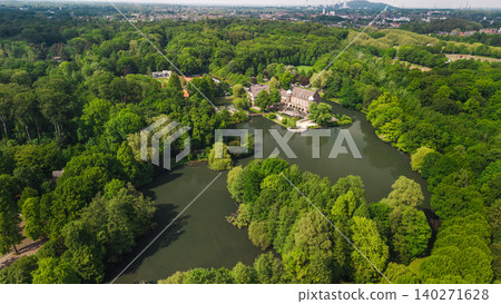 Aerial view of Schloss Borbeck surrounded by lake and green park landscape in Essen Germany Aerial view of Schloss Borbeck surrounded by lake and green park landscape in Essen Germany 140271628