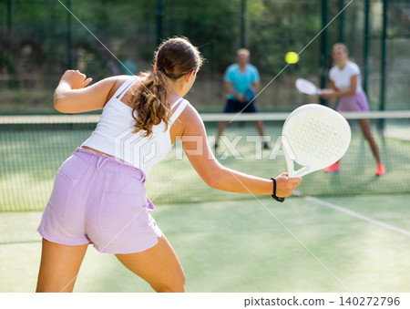 European woman tennis player in padel tennis playing on the outdoor court European woman tennis player in padel tennis playing on the outdoor court 140272796