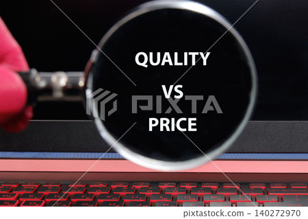 A hand holds a magnifying glass over a laptop screen displaying the phrase quality vs price, highlighting the focus on consumer decision-making in the digital age A hand holds a magnifying glass over a laptop screen displaying the phrase quality vs price, highlighting the focus on consumer decision-making in the digital age 140272970