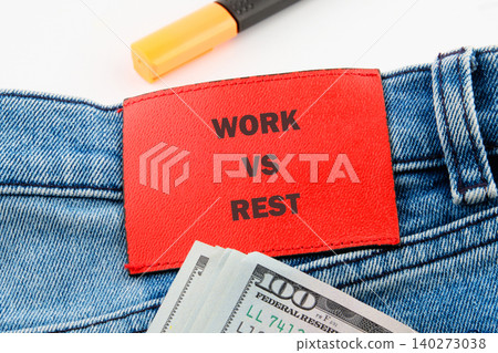 Denim fabric features a bold tag highlighting the theme of work versus rest, accompanied by cash, symbolizing the value of finding balance in life and careers Denim fabric features a bold tag highlighting the theme of work versus rest, accompanied by cash, symbolizing the value of finding balance in life and careers 140273038