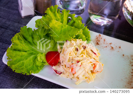 Pasta salad with surimi meat, italian cuisine Pasta salad with surimi meat, italian cuisine 140273095