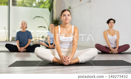 Woman making yoga meditation in lotus pose Woman making yoga meditation in lotus pose 140273432