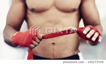 Closeup, man and wrap of hand for fight, martial arts and boxing at fitness and workout studio. Strap, boxer and gym to exercise, practice and training for health, energy and strength for protection Closeup, man and wrap of hand for fight, martial arts and boxing at fitness and workout studio. Strap, boxer and gym to exercise, practice and training for health, energy and strength for protection 140273548