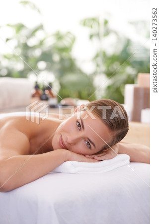 Female person, spa and portrait for wellness, health and self care for relaxation and portrait and therapy. Woman, luxury resort and body treatment for beauty, skincare and detox on massage table Female person, spa and portrait for wellness, health and self care for relaxation and portrait and therapy. Woman, luxury resort and body treatment for beauty, skincare and detox on massage table 140273562
