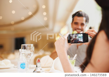 Restaurant, couple taking picture and food with love and digital app with social media or happy. People, man and woman with smartphone or photograph with influencer or cafe for Valentines day or date Restaurant, couple taking picture and food with love and digital app with social media or happy. People, man and woman with smartphone or photograph with influencer or cafe for Valentines day or date 140273569